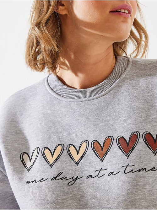 Sweatshirt de gola redonda com estampado de corações lucci - Kiabi