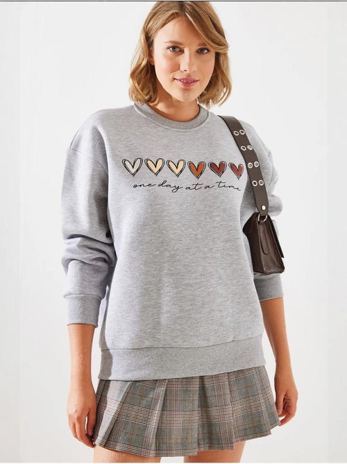 Sweatshirt de gola redonda com estampado de corações lucci - Kiabi