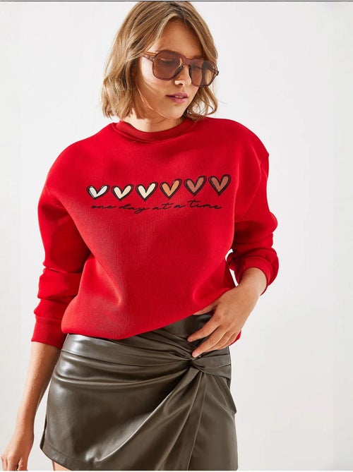 Sweatshirt de gola redonda com estampado de corações lucci - Kiabi