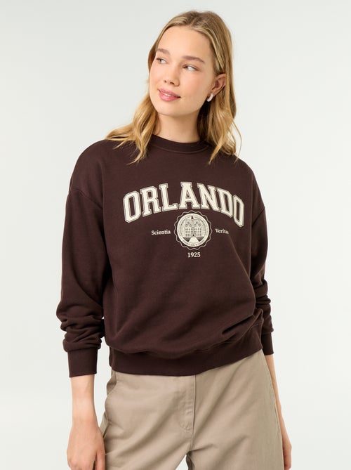 Sweatshirt de gola redonda com inscrição à frente - Kiabi Sweatshirt de gola redonda com inscrição à frente - Kiabi