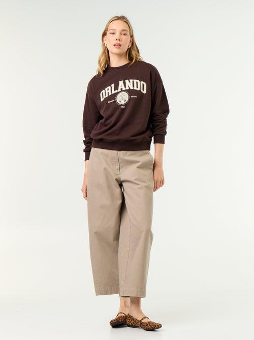 Sweatshirt de gola redonda com inscrição à frente - Kiabi Sweatshirt de gola redonda com inscrição à frente - Kiabi