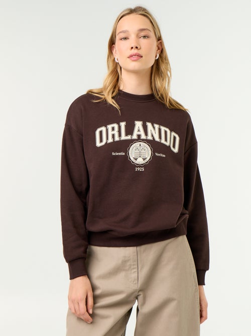 Sweatshirt de gola redonda com inscrição à frente - Kiabi Sweatshirt de gola redonda com inscrição à frente - Kiabi
