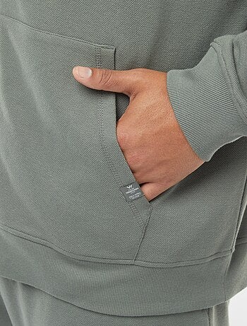 Sweatshirt de malha piqué com abertura com fecho e capuz
