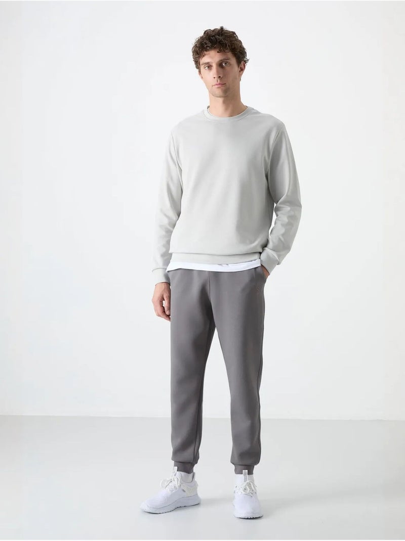 Sweatshirt lisa de homem com gola redonda tommy Cinza pérola - Kiabi