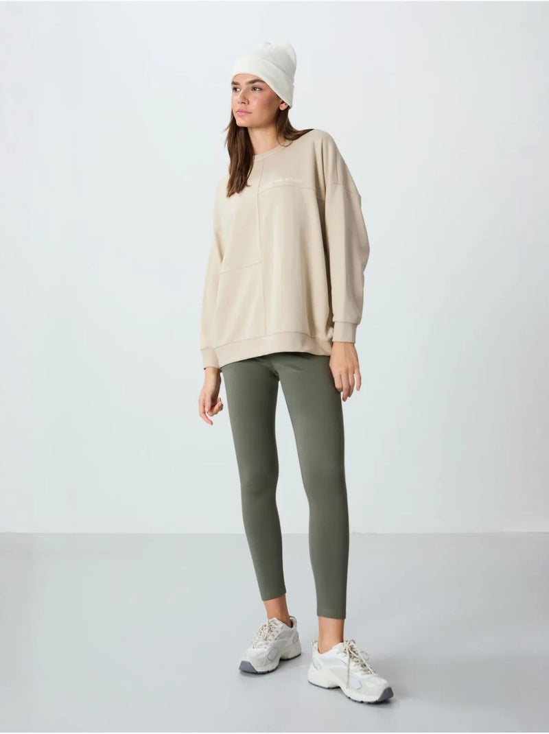 Sweatshirt oversized com gola redonda tommy Bege-argila - Kiabi