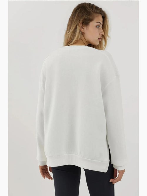Sweatshirt texturizada de gola redonda com detalhe de fecho hiccup - Kiabi Sweatshirt texturizada de gola redonda com detalhe de fecho hiccup - Kiabi