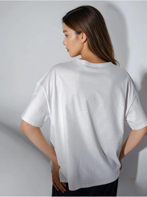 T-shirt com lantejoulas, gola redonda e manga curta busem - Kiabi T-shirt com lantejoulas, gola redonda e manga curta busem - Kiabi