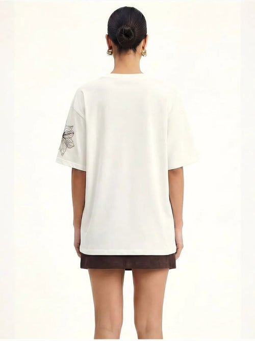 T-shirt de gola redonda com bordado floral lucci - Kiabi T-shirt de gola redonda com bordado floral lucci - Kiabi