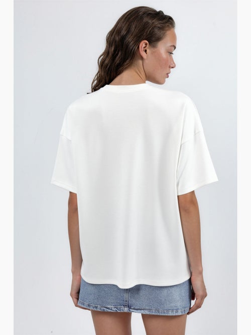 T-shirt de malha oversized com gola redonda e toque de modal hiccup - Kiabi T-shirt de malha oversized com gola redonda e toque de modal hiccup - Kiabi