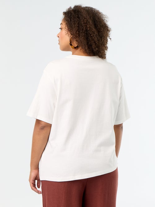 T-shirt drapeada com joia dourada tipo broche - Kiabi T-shirt drapeada com joia dourada tipo broche - Kiabi