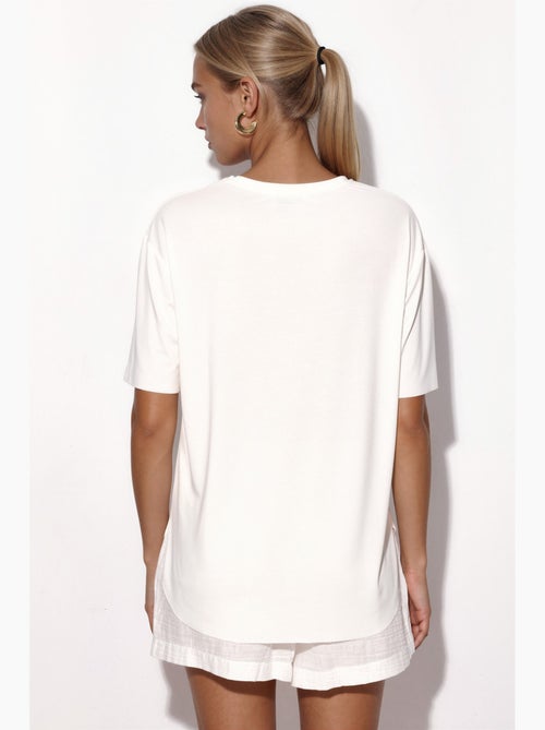 T-shirt loose fit com gola redonda busem - Kiabi T-shirt loose fit com gola redonda busem - Kiabi