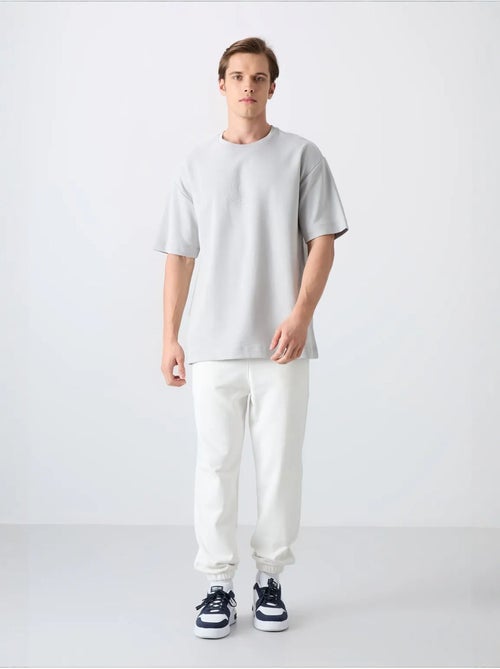 T-shirt oversize de gola redonda em mistura de algodão tommy - Kiabi T-shirt oversize de gola redonda em mistura de algodão tommy - Kiabi