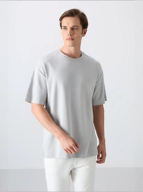 T-shirt oversize de gola redonda em mistura de algodão tommy - Kiabi T-shirt oversize de gola redonda em mistura de algodão tommy - Kiabi
