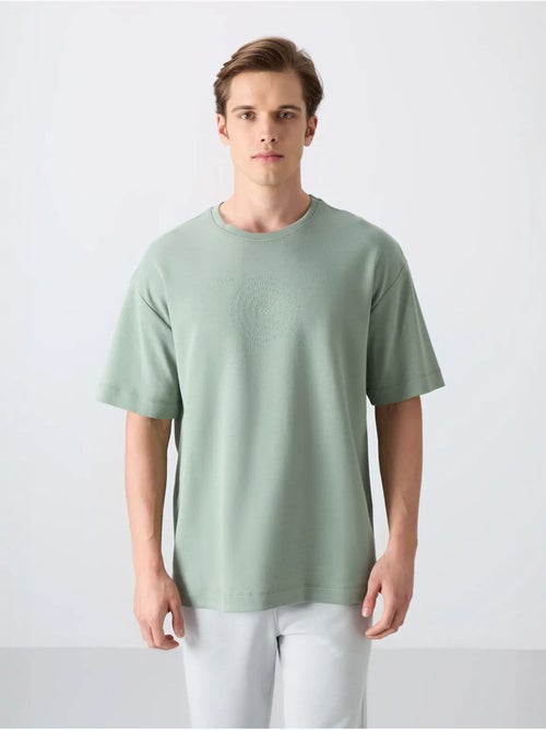 T-shirt oversize de gola redonda em mistura de algodão tommy - Kiabi T-shirt oversize de gola redonda em mistura de algodão tommy - Kiabi