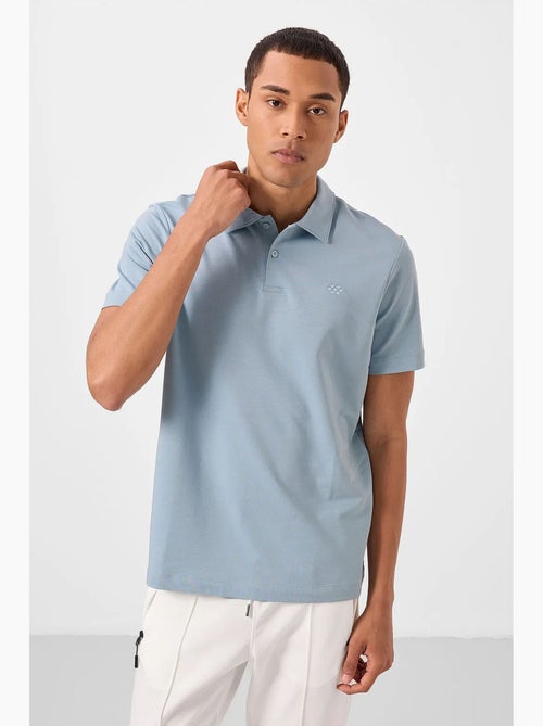 T-shirt polo em malha de mistura de algodão para homem tommy - Kiabi T-shirt polo em malha de mistura de algodão para homem tommy - Kiabi