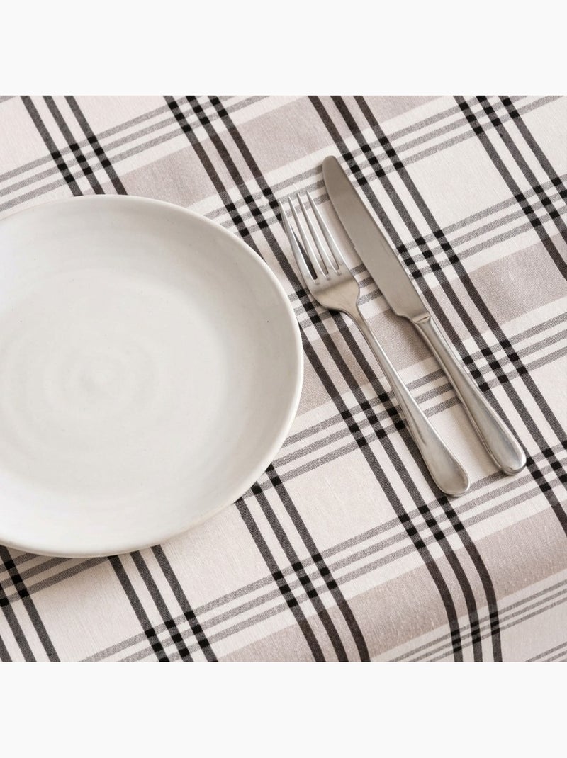 Toalha de mesa antinódoas com quadrados e riscas múltiplas, toque e caimento natural - Gamusi. Preto Bege - Kiabi