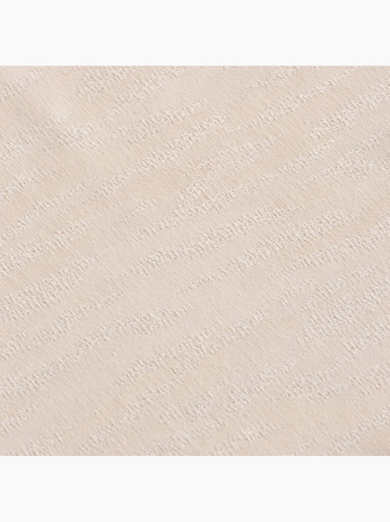 Toalha de mesa antinódoas com tecido texturizado de efeito raiado - Gamusi. Creme - Kiabi