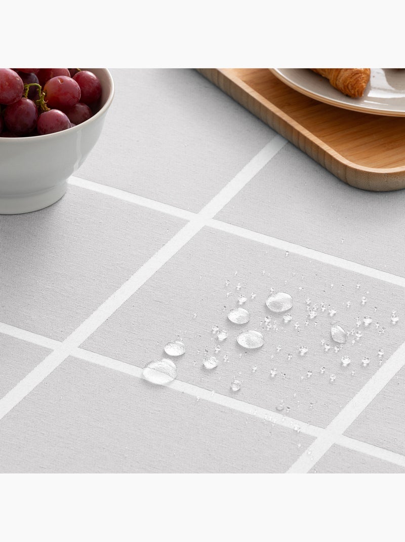 Toalha de mesa antinódoas com tecido texturizado e quadrados grandes - Gamusi. Cinza claro - Kiabi
