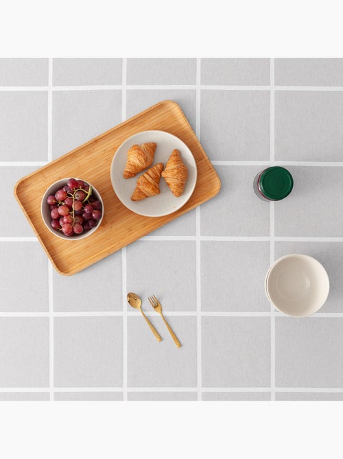 Toalha de mesa antinódoas com tecido texturizado e quadrados grandes - Gamusi. - Kiabi Toalha de mesa antinódoas com tecido texturizado e quadrados grandes - Gamusi. - Kiabi