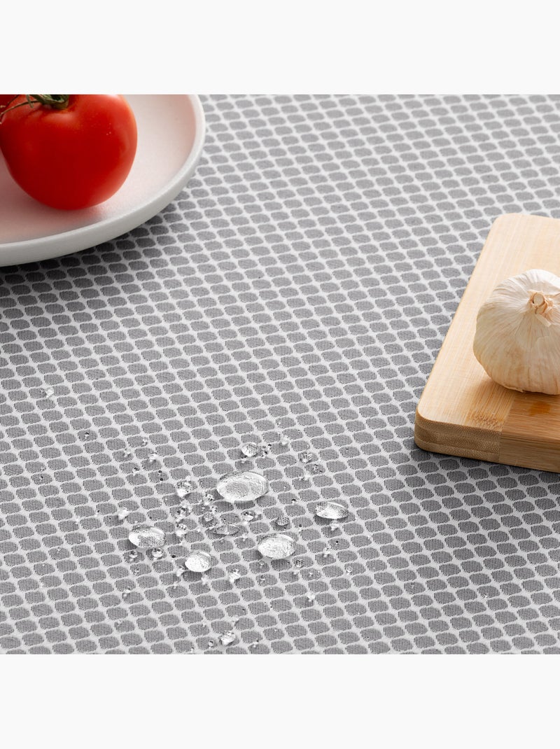 Toalha de mesa antinódoas texturizada, padrão de quadrados em grelha - Gamusi. Cinza antracite - Kiabi