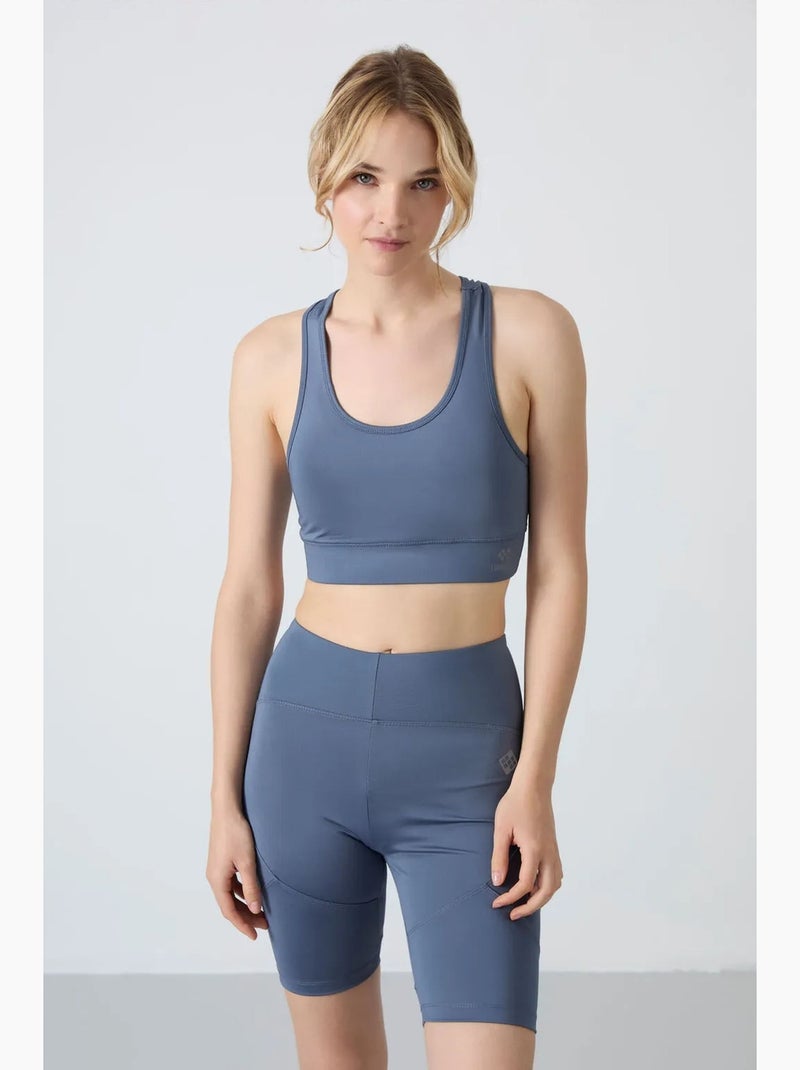 Top desportivo curto justo sem mangas tommy Azul - Kiabi
