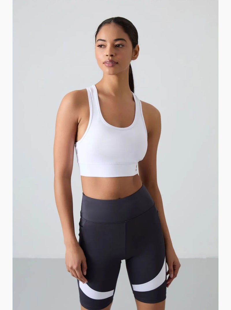 Top desportivo curto justo sem mangas tommy Branco - Kiabi
