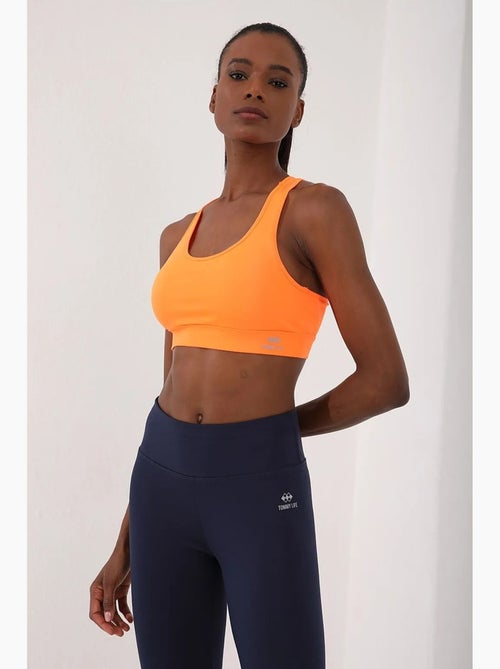 Top desportivo curto justo sem mangas tommy - Kiabi Top desportivo curto justo sem mangas tommy - Kiabi