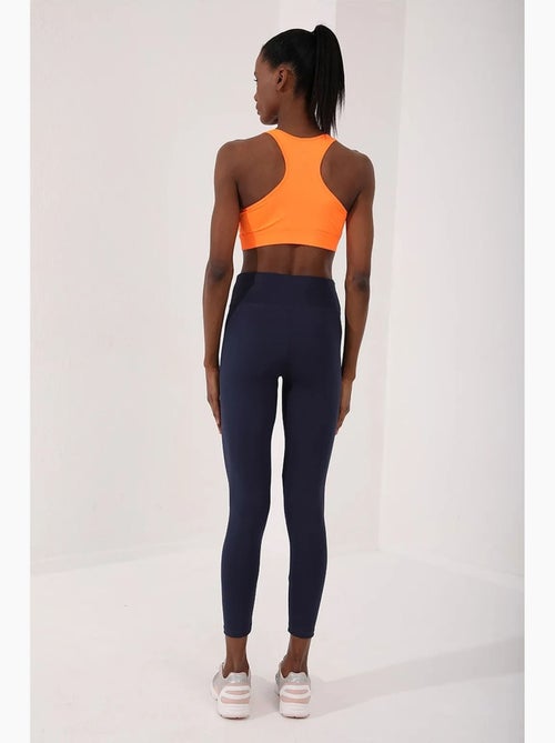 Top desportivo curto justo sem mangas tommy - Kiabi Top desportivo curto justo sem mangas tommy - Kiabi