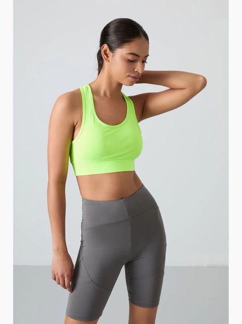 Top desportivo curto justo sem mangas tommy - Kiabi Top desportivo curto justo sem mangas tommy - Kiabi
