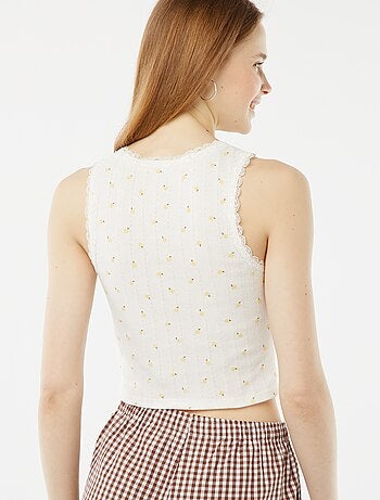 Top em malha pointelle com renda e motivo
