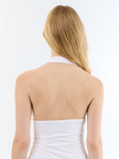 Top em tecido elástico com gola halter - Kiabi Top em tecido elástico com gola halter - Kiabi