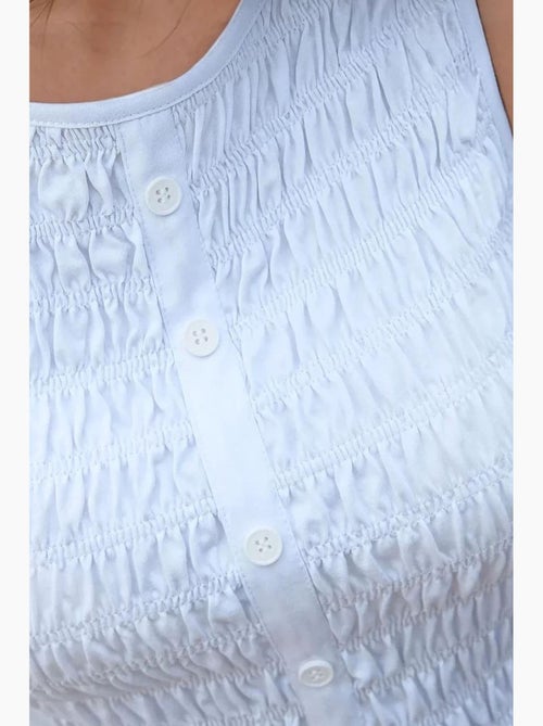 Top slim fit com gola redonda texturizado hiccup - Kiabi Top slim fit com gola redonda texturizado hiccup - Kiabi
