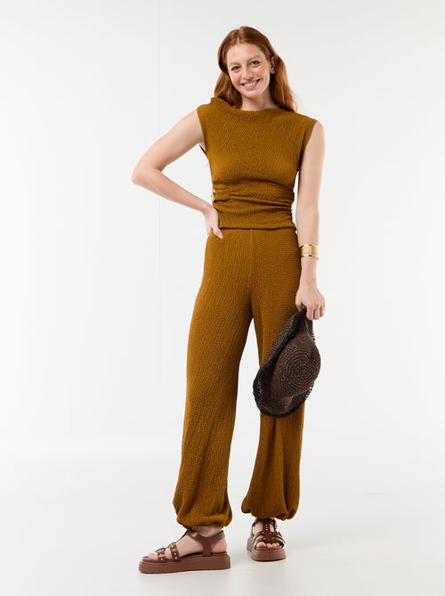 Top stretch liso assimétrico sem mangas - Kiabi