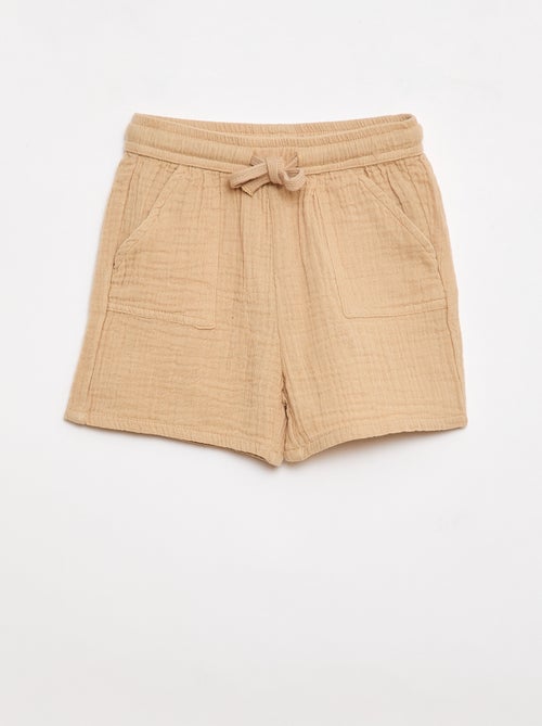 Um conjunto de duas peças camisa + calções - Kiabi