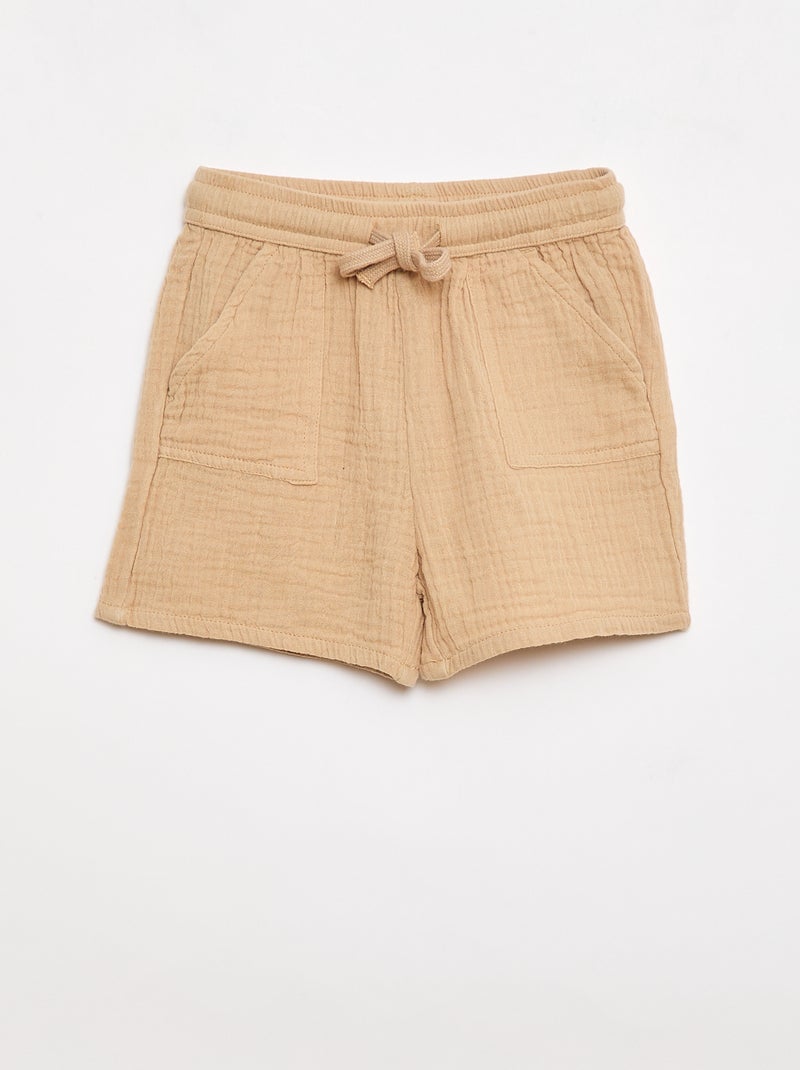 Um conjunto de duas peças camisa + calções Bege - Kiabi