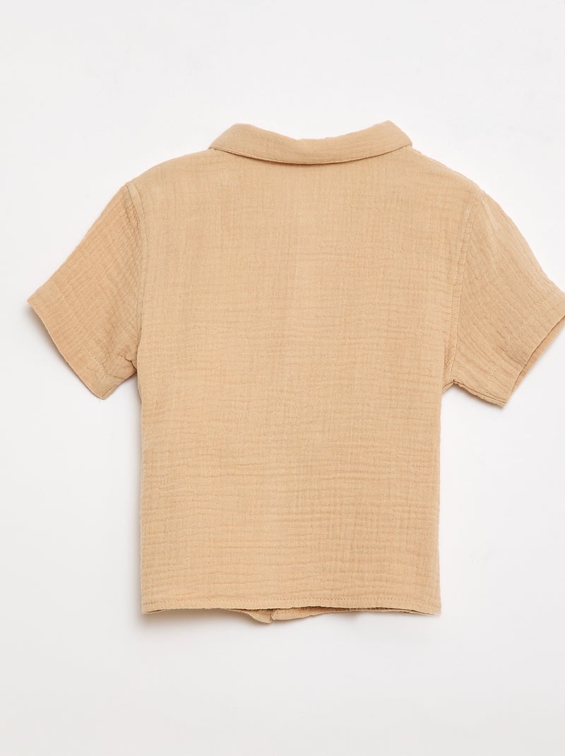 Um conjunto de duas peças camisa + calções Bege - Kiabi