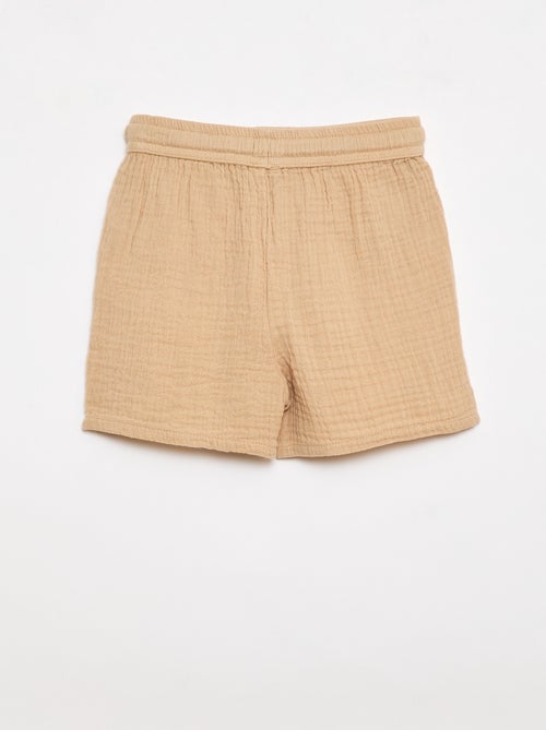 Um conjunto de duas peças camisa + calções - Kiabi