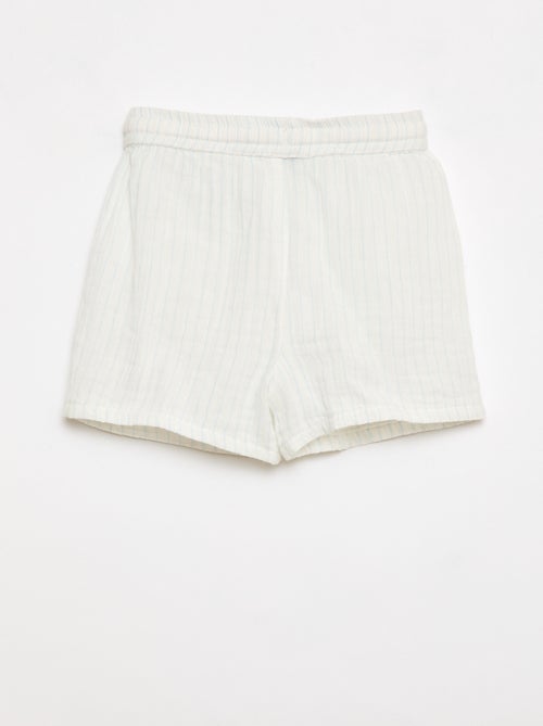 Um conjunto de duas peças camisa + calções - Kiabi