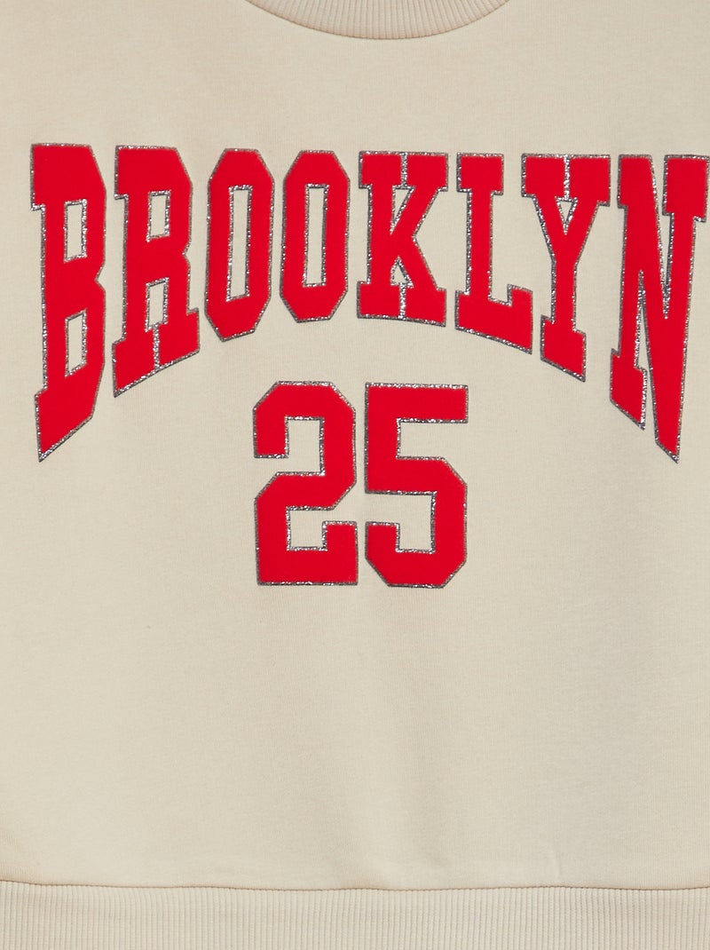 Vestido-camisola em moletão com inscrição em relevo e brilhantes BEGE - Kiabi