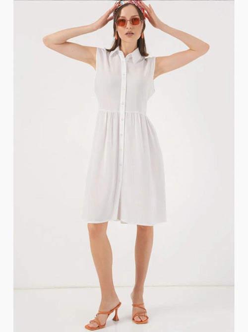 Vestido midi sem mangas com botões e colarinho de camisa bdart - Kiabi Vestido midi sem mangas com botões e colarinho de camisa bdart - Kiabi