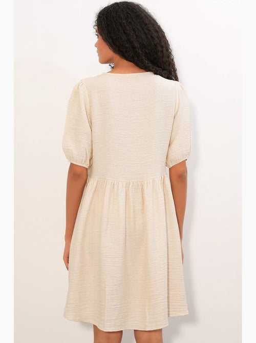 Vestido mini smock feminino em linha a bdart - Kiabi Vestido mini smock feminino em linha a bdart - Kiabi