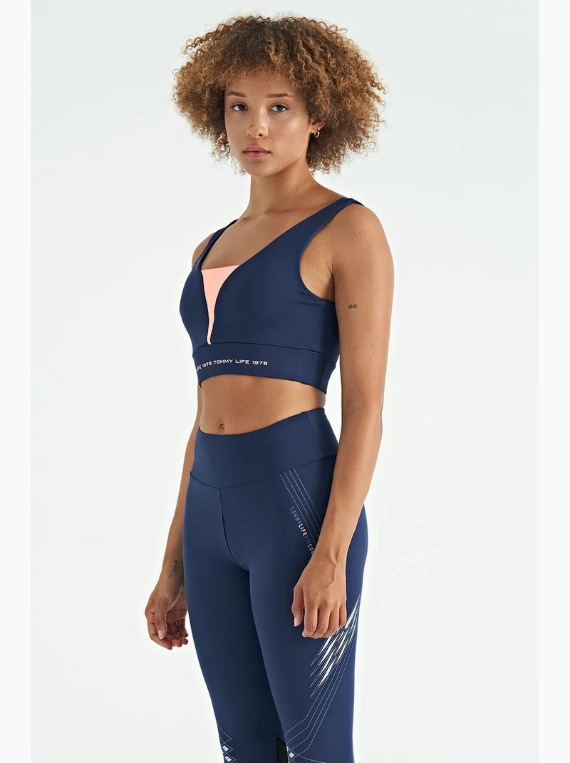 Women's top desportivo curto sem mangas com blocos de cor tommy Azul Rosa - Kiabi