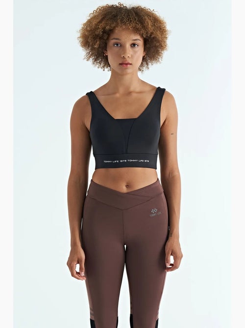 Women's top desportivo curto sem mangas com blocos de cor tommy - Kiabi Women's top desportivo curto sem mangas com blocos de cor tommy - Kiabi