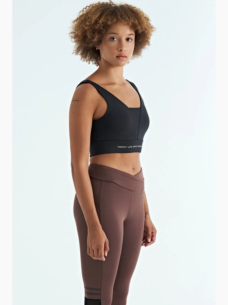 Women's top desportivo curto sem mangas com blocos de cor tommy Preto - Kiabi